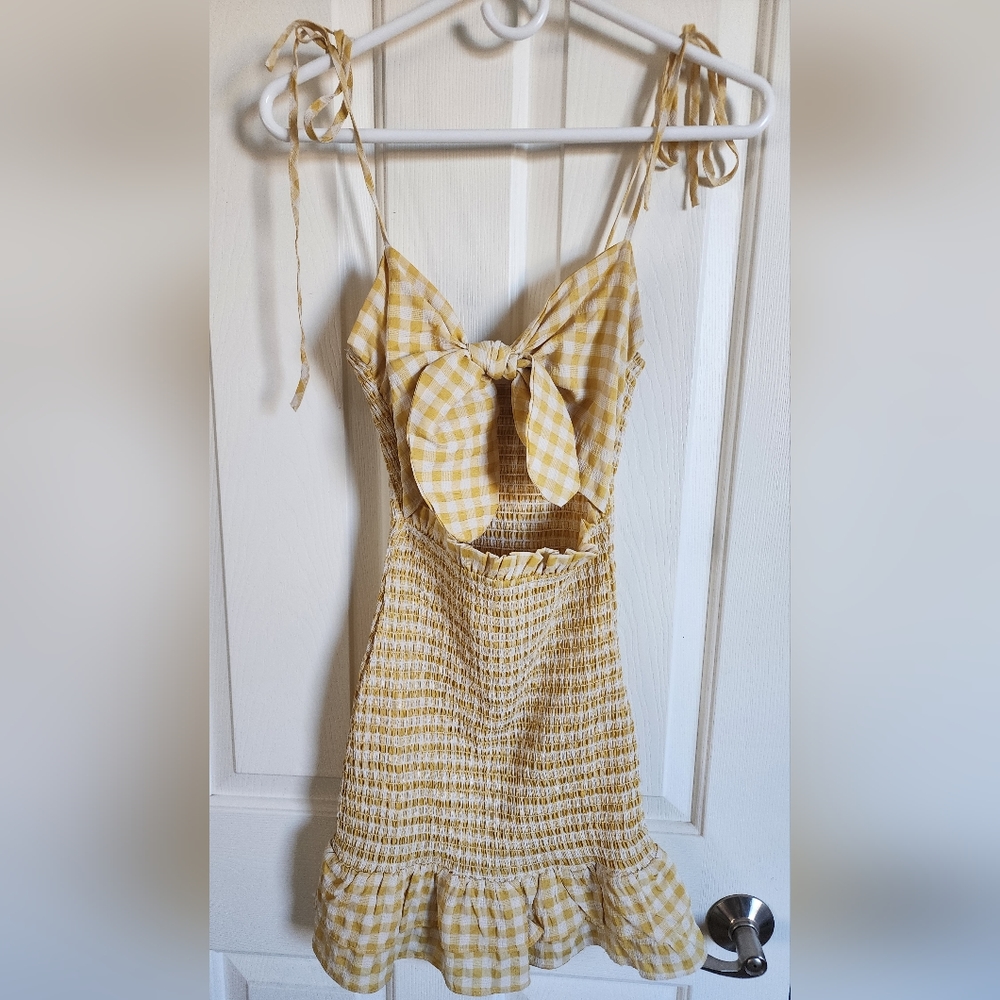 EUC- sexy gingham print dress with open area and tie detail at chest. Size S.